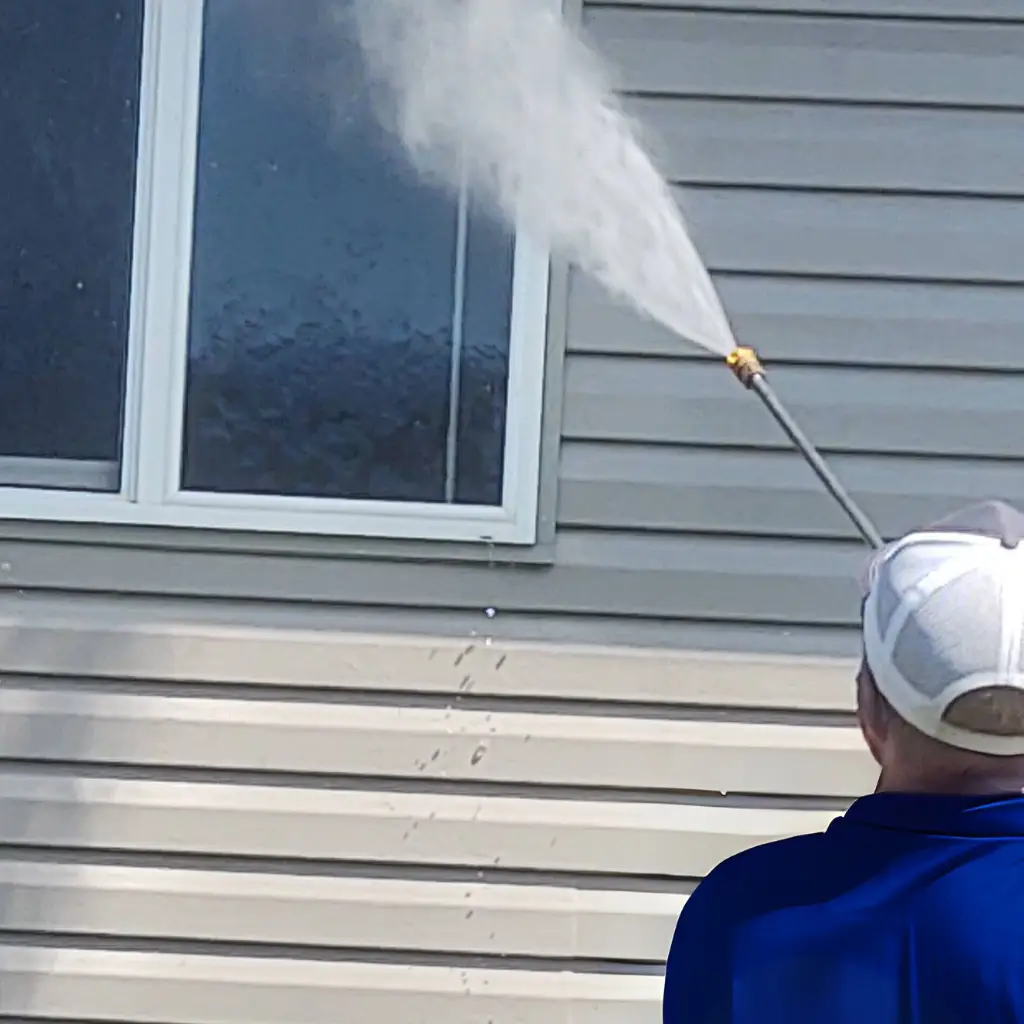 Pressure washing vinyl siding on a home in Idaho Falls